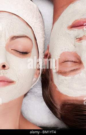 Couple with face pack on their faces Stock Photo