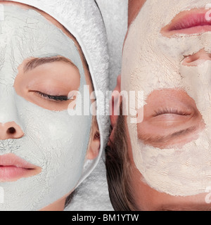 Couple with face pack on their faces Stock Photo