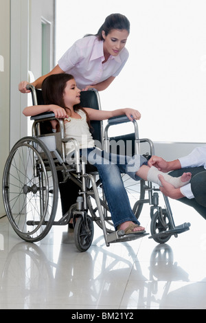 Female doctor with a patient in a wheelchair Stock Photo