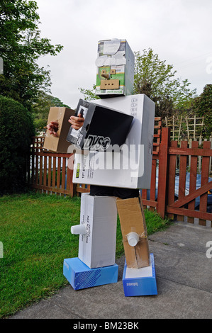 a child wearing a home made cardboard robot suit, uk Stock Photo