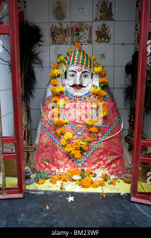 Hindu street shrine, decorated with marigold mala (garlands) for Diwali festival, Udaipur, Rajasthan, India, Asia Stock Photo