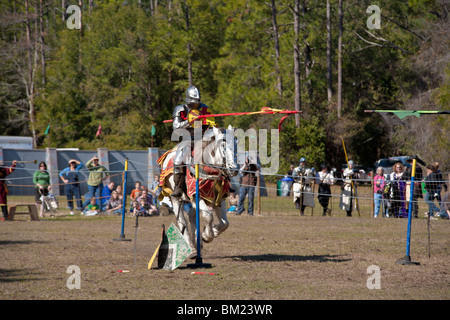 Gainesville FL - Jan 2009 - Men dressed as knights on horseback charge each other in jousting demonstration Stock Photo