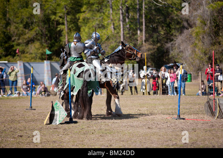 Gainesville FL - Jan 2009 - Two men dressed in armor on horseback sword fighting during jousting demonstration Stock Photo