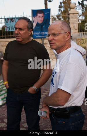 Father Noam Shalit with redeemed POW Chezi Shai at a Sabbath welcoming ceremony for abducted IDF soldier Gilad Shalit Stock Photo