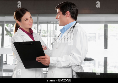 Two doctors talking in a hospital Stock Photo