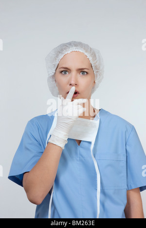 Portrait of a female surgeon looking surprised Stock Photo