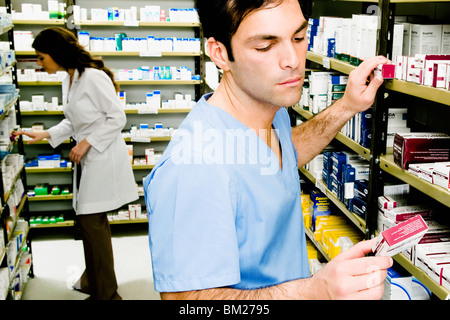 Two pharmacists in a pharmacy Stock Photo