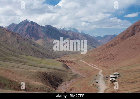 Pamir Highway leading into wilderness, Kyrgyzstan, Central Asia Stock Photo