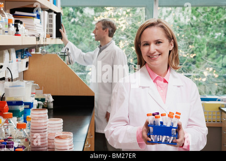 Female doctor holding medical samples in a laboratory Stock Photo