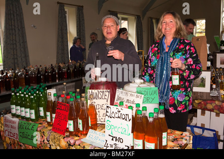 UK, England, Herefordshire, Putley, Big Apple Event, John and Georgina Stewart of Munsley Cider with their products Stock Photo