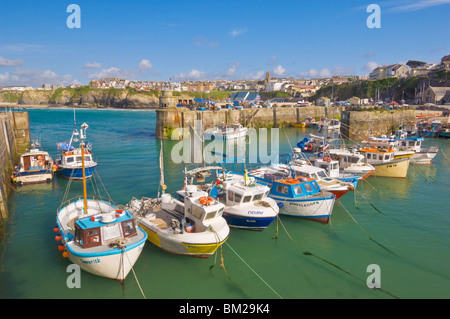 Small fishing boats in the harbour at high tide, Newquay, North Cornwall, UK Stock Photo