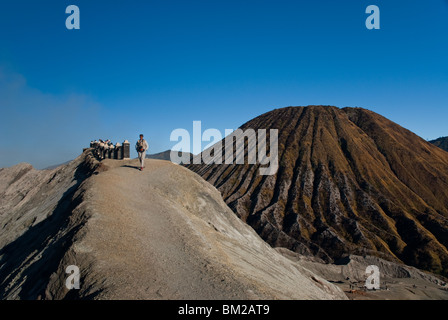 Walking on top of Mt Bromo Stock Photo