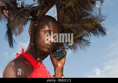 Masai man talking on mobile phone, Masai Mara, Kenya, East Africa Stock Photo