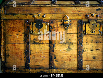 Old wooden chest, trunk in golden color and rusty Stock Photo