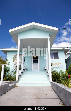 The quaint painted building of the local school on Man O War Cay in the Bahamas. Stock Photo