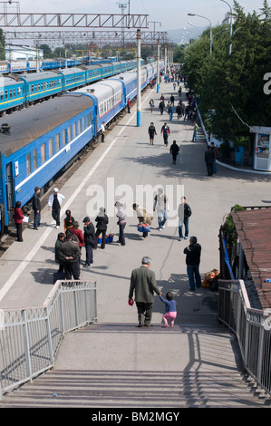 Railway station with passengers and trains, Almaty, Kazakhstan Stock Photo