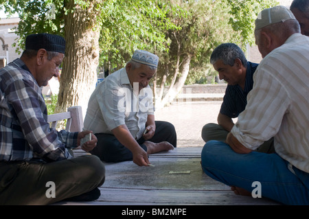 Men playing dominos, Bokhara, Uzbekistan Stock Photo