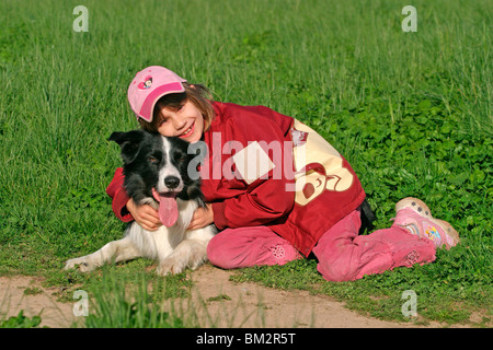 Mädchen mit Border Collie / girl with Border Collie Stock Photo