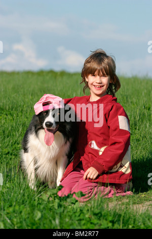 Mädchen mit Border Collie / girl with Border Collie Stock Photo