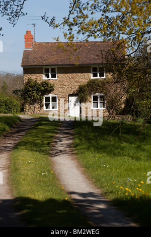 UK, England, Herefordshire, Putley Common, attractive stone built detached rural cottage Stock Photo