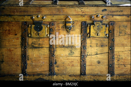 Old wooden chest, trunk in golden color and rusty Stock Photo