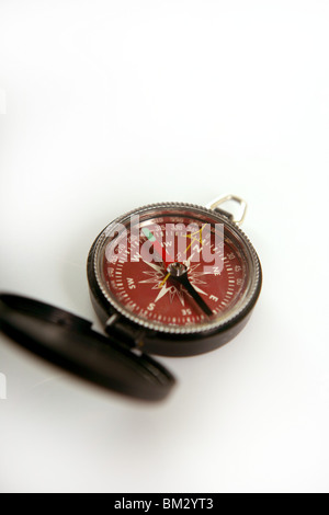 Red open magnetic compass, white background Stock Photo