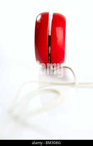 Red yoyo with thread isolated over white background Stock Photo