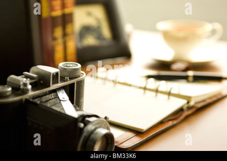 Camera on a desk Stock Photo