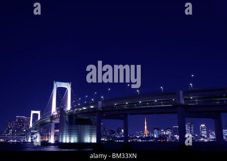 Illuminated Rainbow Bridge in the night, long exposure, Tokyo prefecture, Japan Stock Photo