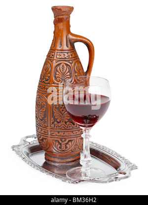 Ancient ceramic bottle with Georgians wine on a white background Stock Photo
