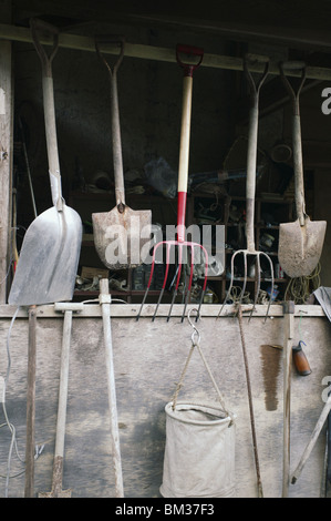 Farm tools in a barn Stock Photo - Alamy