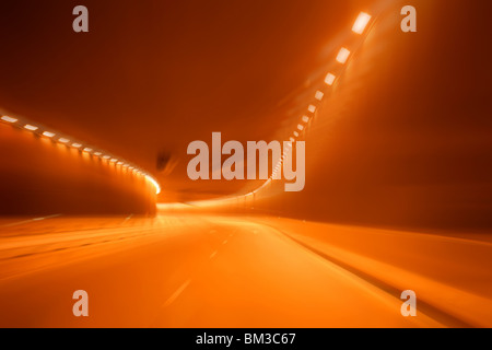 Red golden blurred light tunnel, alcoholic driver Stock Photo