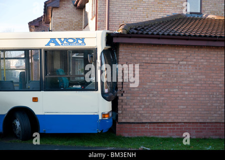 Bus crashed into wall of house Stock Photo