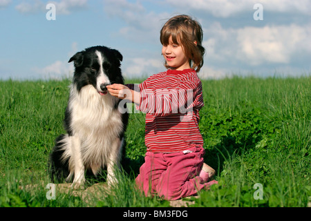 Mädchen mit Border Collie / girl with Border Collie Stock Photo