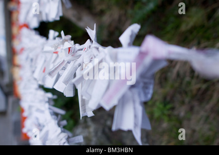 Omikuji messages at a Japanese Shinto Shrine, Asia. Stock Photo