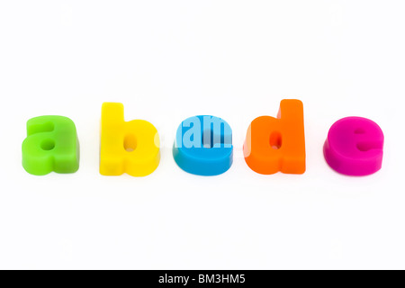 colorful magnetic fridge magnet letters on a white background Stock Photo