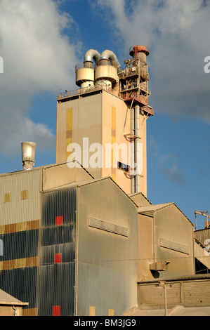 Corrugated Iron Tower & External Pipes of Cement Works or Factory, Beaucaire, Gard Département, France Stock Photo