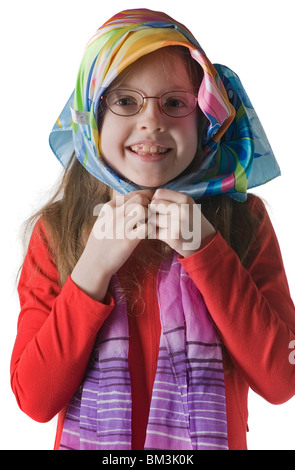 Little girl in glasses holds headscarf a hands, isolated on white Stock Photo