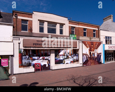 Empty shops decorated by the Local Council using large photographs to make them more attractive a so-called 'virtual Shop' Stock Photo