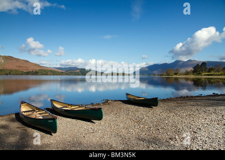 'Derwent Water' Canoes On The Shoreline Skiddaw In The Distance The Borrowdale Valley 'The Lake District' Cumbria England UK Stock Photo