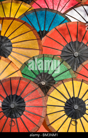 Multicoloured paper umbrellas or parasols on display at  Luang Prabang evening market, Laos Stock Photo