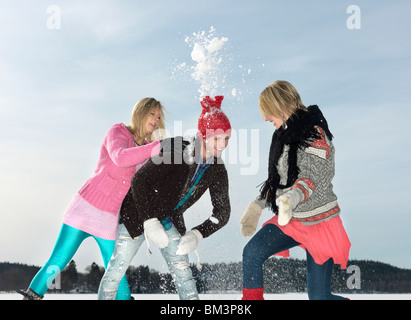 Friends having snow fight Stock Photo