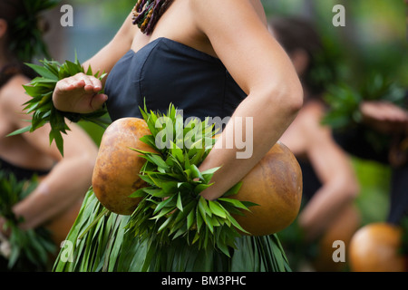 Traditional Hawaiian Hula (Kahiko) performed with ipu (drum) on Hawaii Island. Stock Photo