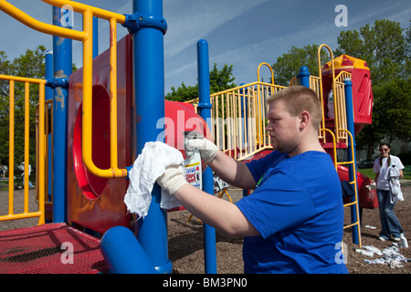 Volunteers Clean Up Playground Stock Photo