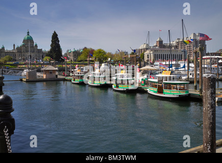 The Inner Harbour in Victoria, Vancouver Island, British Columbia. Water taxis line up on the dock waiting for passengers Stock Photo