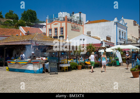 Bars and Restaurants in a Narrow Street at Alvor Algarve Portugal Stock ...