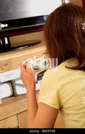 teenager playing video games Stock Photo
