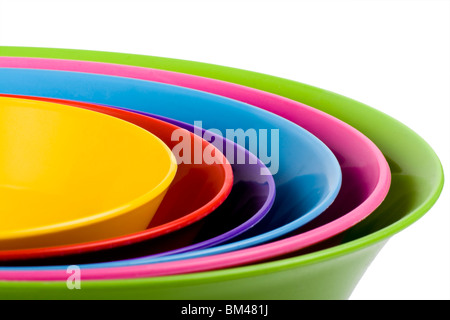 Stack of colorful plastic bowls over white background Stock Photo