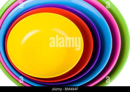 Stack of colorful plastic bowls over white background Stock Photo