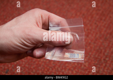 bag of acid trips Blotting paper impregnated with the drug L.S.D. LSD Stock Photo